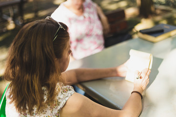 Woman taking notes outside