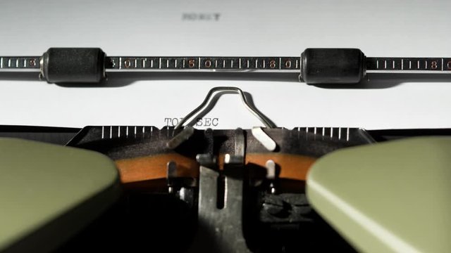 TOP SECRET written on old green vintage retro typewriter mystery policy government agency
