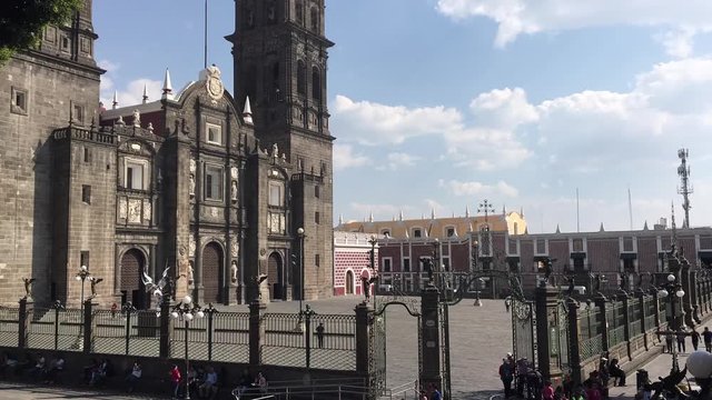 The Cathedral of Puebla City in Mexico with people.