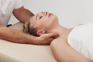 Obraz na płótnie Canvas Massage of the head and cervical spine with an osteopath