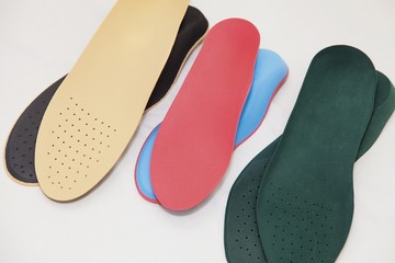 Orthopedic insoles for legs on a white background