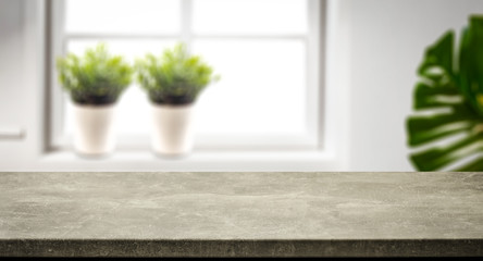 Desk of free space and window background in home interior 