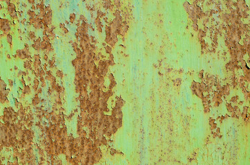 The wall is made of metal. Metal fence. Metal structure. Rusty metal.
