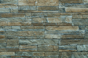 Stone wall. The wall is made of stone. The wall is made of bricks. The structure of the stone.