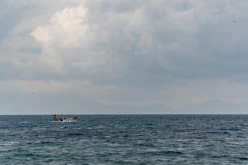 Traditional small Turkish fishing boat at sea.