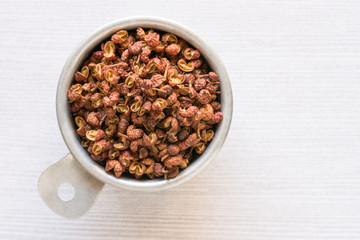 Szechuan Peppercorns in a Measuring Cup