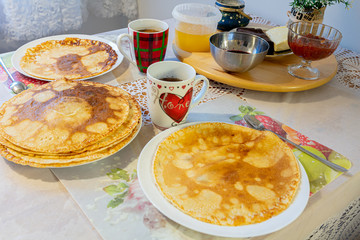 Laid dinner table. Pancakes. On a white background, close-up. Shrovetide. Breakfast.