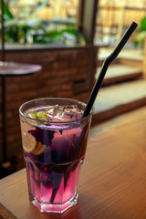 fresh basil lemonade with lemon on a table, selective focus
