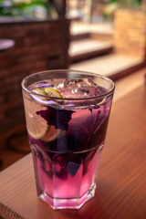 fresh basil lemonade with lemon on a table, selective focus