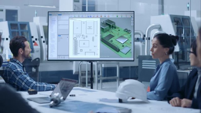 Factory Office Meeting Room: Diverse Team of Computer Design Engineers, Managers and Investors Talking at Conference Table, Watching Interactive TV that shows 3D Concept Model of Printed Circuit Board