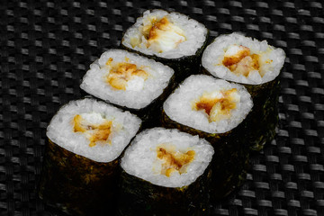 Japanese rolls on a dark textured background