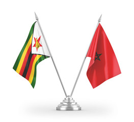 Morocco and Zimbabwe table flags isolated on white 3D rendering