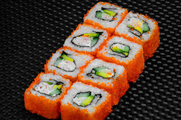 Japanese rolls on a dark textured background