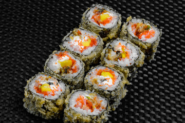 Japanese rolls on the dark textured background