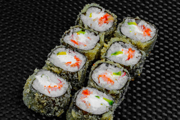 Japanese rolls on the dark textured background