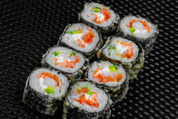 Japanese rolls on the dark textured background