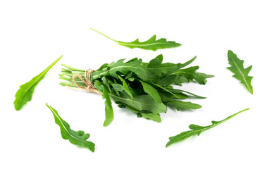 bunch of fresh arugula isolated on a white background.