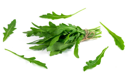bunch of fresh arugula isolated on a white background.