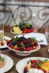 Raw fresh organic fruit and berries plate