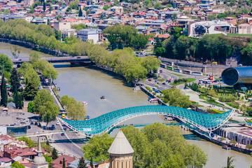 Panoramic view of Tbilisi city from Sololaki Hill, old town and modern architecture.  Bridge of Peace Presidential  and Concert Music Theatre Exhibition Hall. Georgia