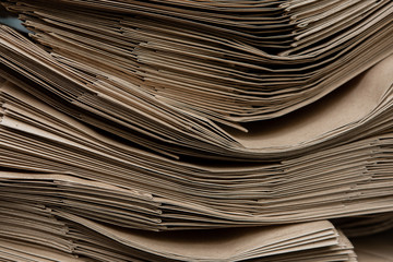 Side View Of Huge Stack of Recycled Paper close up. Business concept. Huge Stack of Recycled Paper envelopes closeup.