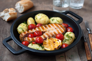 Grilled Wild Salmon Steak with Potatoes and Tomatoes