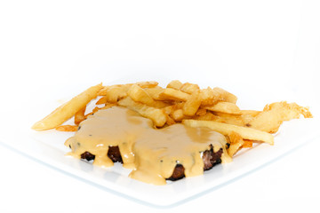 Argentinian food. Milanesa with bacon and cheese with french fries