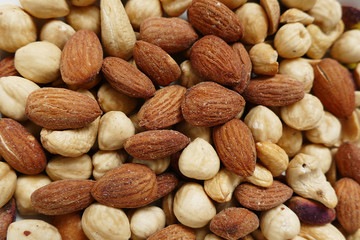 Fresh dried nuts, almonds and cashews, close-up, crispy nuts, roasted hazelnuts