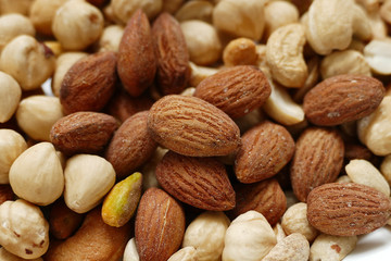 Fresh dried nuts, almonds and cashews, close-up, crispy nuts, roasted hazelnuts