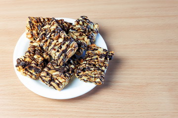 top view of wheat flour dough, caramel nuts and chocolate. Space for text