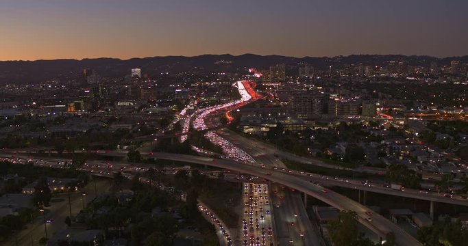 Los Angeles Aerial v228 Following the San Diego freeway north toward hills at sunset dusk - October 2019