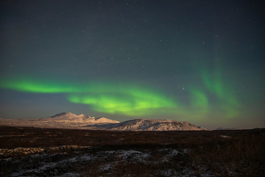 Northern lights above the glaciers in Iceland © Peter Maszlen