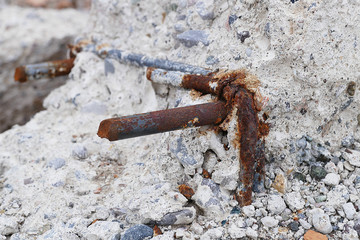 rotten concrete and iron, materials that are not earthquake resistant,