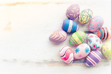 Easter eggs painting decorated on pastel wooden backgrounds with copy space for April Easter day