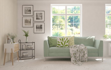 Minimalist living room in white color with sofa and summer landscape in window. Scandinavian interior design. 3D illustration