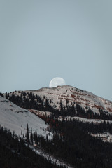 Moon Setting over the Mountainous Horizon