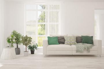 Minimalist living room in white color with sofa and summer landscape in window. Scandinavian interior design. 3D illustration