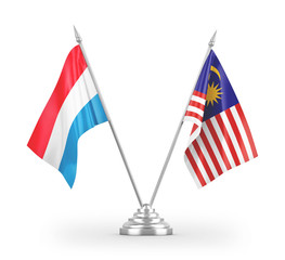 Malaysia and Luxembourg table flags isolated on white 3D rendering