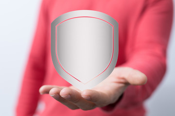 shield protection concept holding in hand