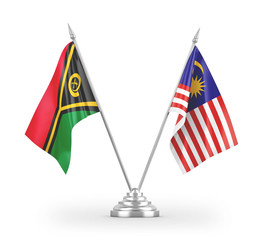 Malaysia and Vanuatu table flags isolated on white 3D rendering