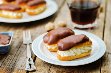 eclairs with cheese cream and chocolate glaze
