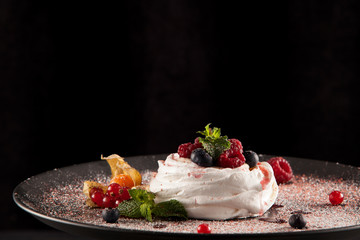 Delicious meringue dessert with natural berries. Gluten free. Closeup. Copy space