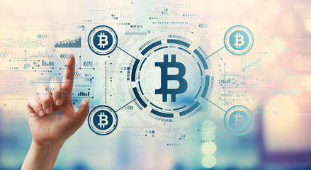 Bitcoin theme with hand pressing a button on a technology screen