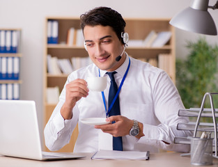 Handsome customer service clerk with headset