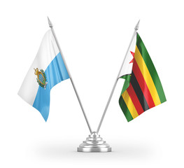 Zimbabwe and San Marino table flags isolated on white 3D rendering