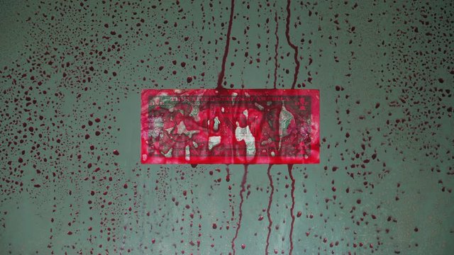Blood money. The banknote face value of 1 dollar. The theme of hired murder and corruption. Behind clear glass covered with red drops