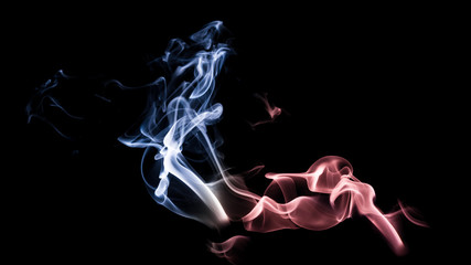 Red and blue abstract macro smoke swirls and patterns isolated on black background