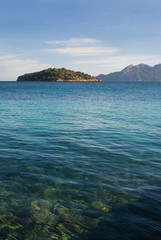 Fototapeta premium Beautiful scenery on the coast of Majorca. Sea and rocks covered with green forests. Majorca, Spain