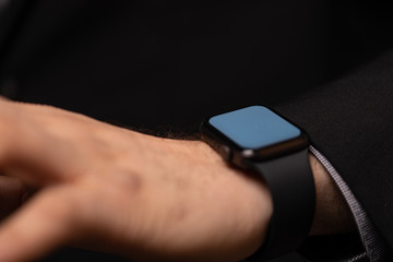 Close up of Businessman's hand looking at hand watch