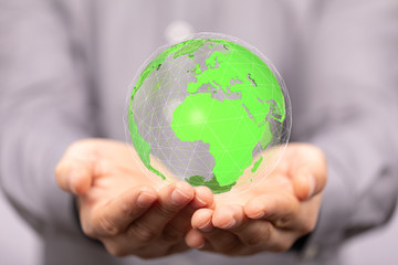 Human Hand Holding The World In Hands.